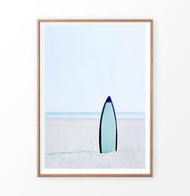 Load image into Gallery viewer, Blue Surfboard in the sand, Blue Sky and Ocean Wall Art Print
