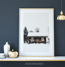 Load image into Gallery viewer, Gold-framed Wooden Cabin Covered in Snow Poster