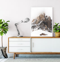 Load image into Gallery viewer, White-framed Snowy House Under A Cliff In The Mountains Wall Art
