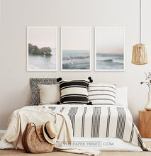 Load image into Gallery viewer, Three ocean photos in frames on a bedroom wall