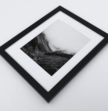 Load image into Gallery viewer, A poster with a foggy mountains landscape in a black frame

