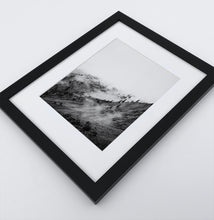 Load image into Gallery viewer, A poster with a foggy mountains landscape in a black frame
