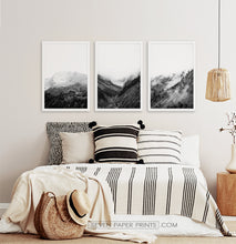 Load image into Gallery viewer, 3 posters of black and white foggy mountain landscapes above a bed