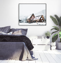 Load image into Gallery viewer, Wall art with wonderful snowy cabins in black frame