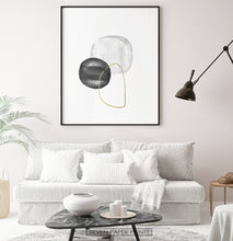 Load image into Gallery viewer, A black-framed wall art with black, silver and golden forms in a living room