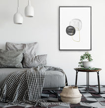 Load image into Gallery viewer, A black-framed wall art with black, silver and golden forms in a bedroom