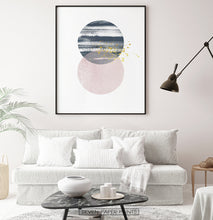 Load image into Gallery viewer, Black-framed Navy and pink Jupiter-like abstract wall art in a living room