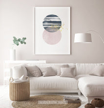 Load image into Gallery viewer, White-framed Navy and pink Jupiter-like abstract wall art in a living room