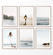 Load image into Gallery viewer, Coastal Wall Art Prints. Beach with palm trees and surfer. Ocean rock