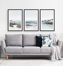 Load image into Gallery viewer, Three white shore of the ocean photos in frames above the sofa