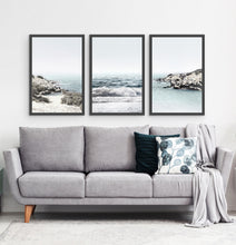 Load image into Gallery viewer, Three white shore of the ocean photos in frames above the sofa