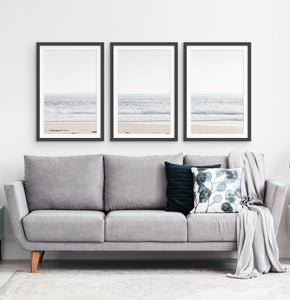 Three framed photo prints of an ocean coast