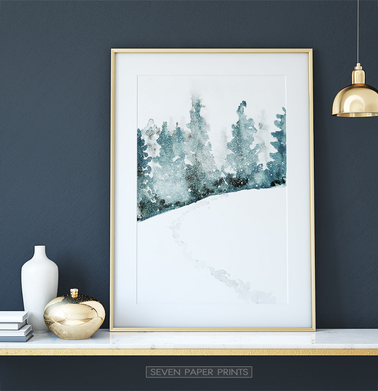 Golden-framed on a white marble shelf