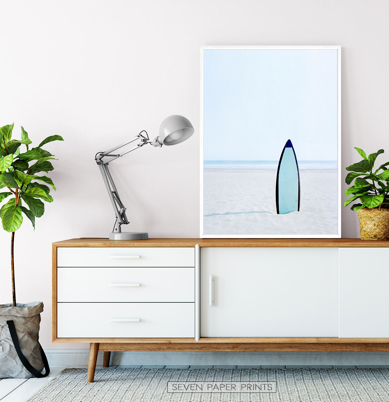 Blue Surfboard Stuck Upright in the Sand Wall Art
