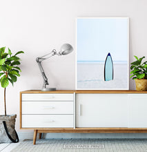 Load image into Gallery viewer, Blue Surfboard Stuck Upright in the Sand Wall Art
