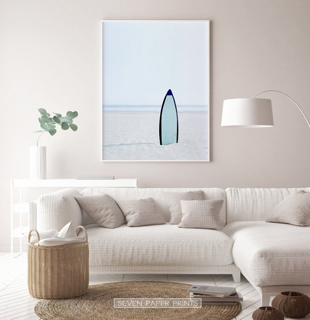 Blue Surfboard Stuck Upright in the Sand Wall Art