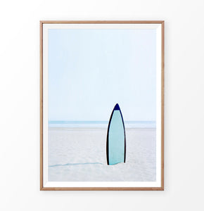 Blue Surfboard in the sand, Blue Sky and Ocean Wall Art Print