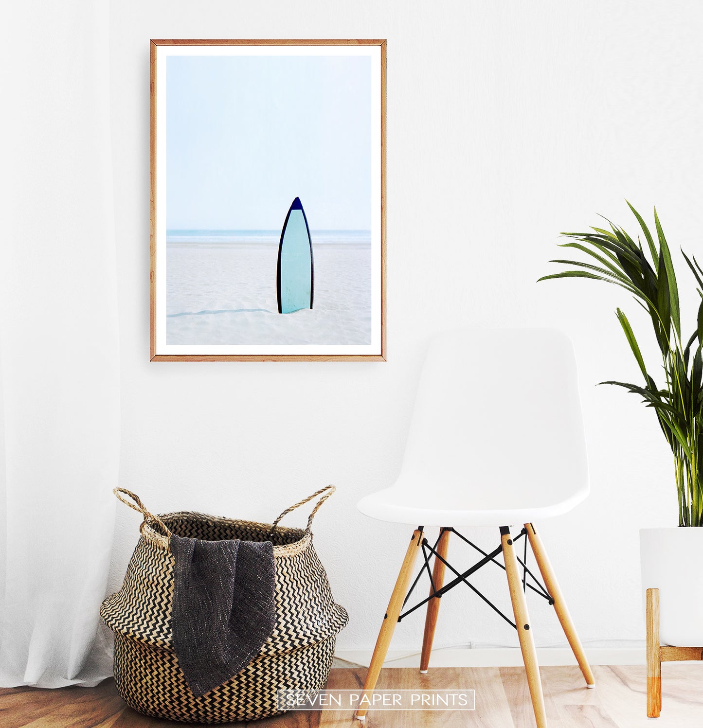 Blue Surfboard Stuck Upright in the Sand Wall Art