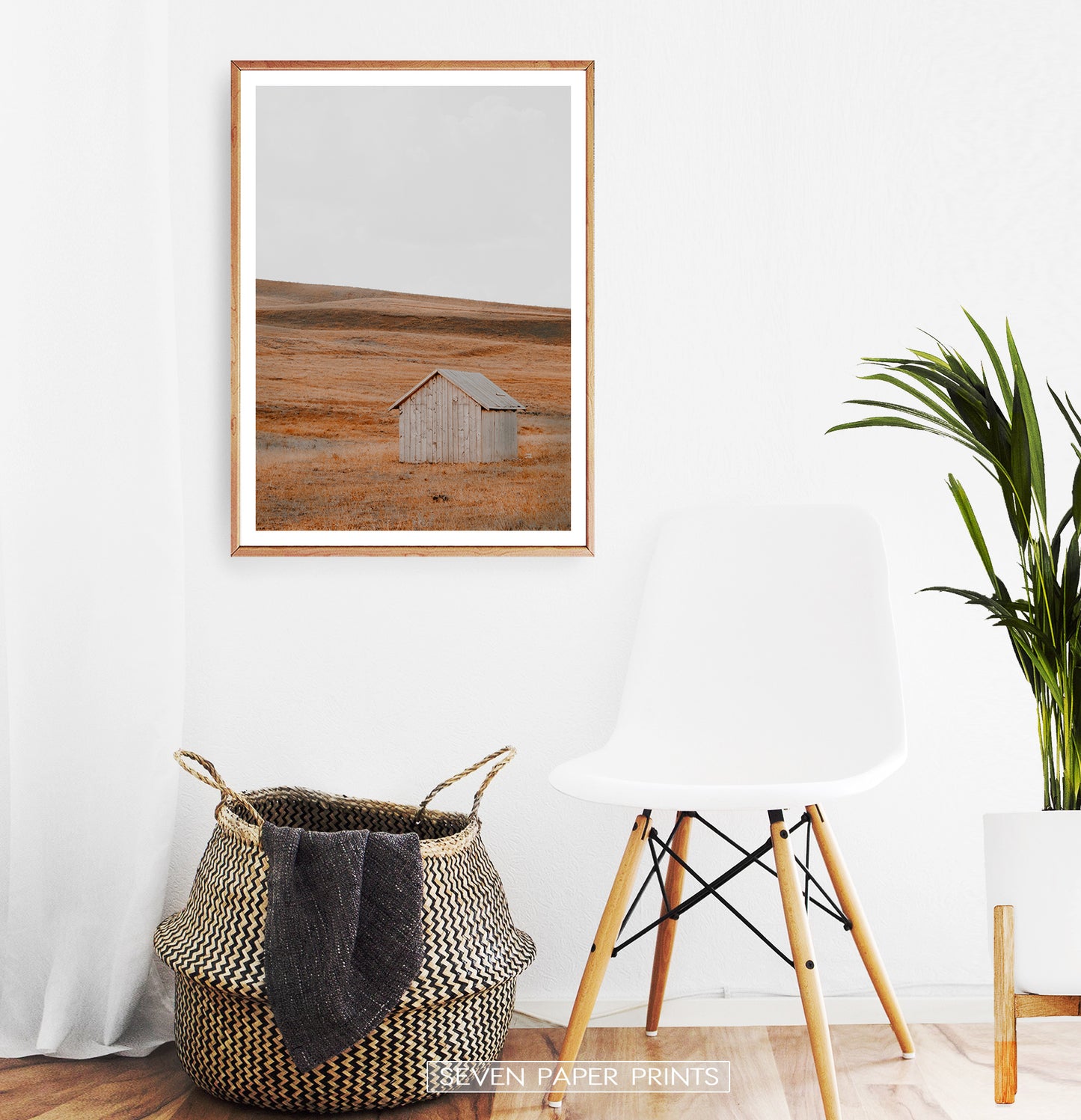 Wooden-framed photo print in the white room