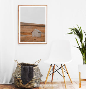 Wooden-framed photo print in the white room