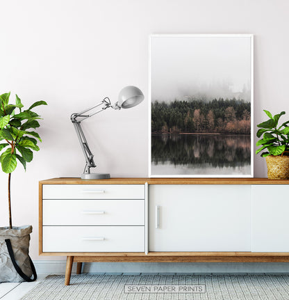 White-framed on a wooden and white cabinet