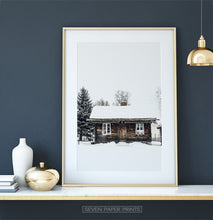 Load image into Gallery viewer, Gold-framed Wooden Cabin Covered in Snow Poster
