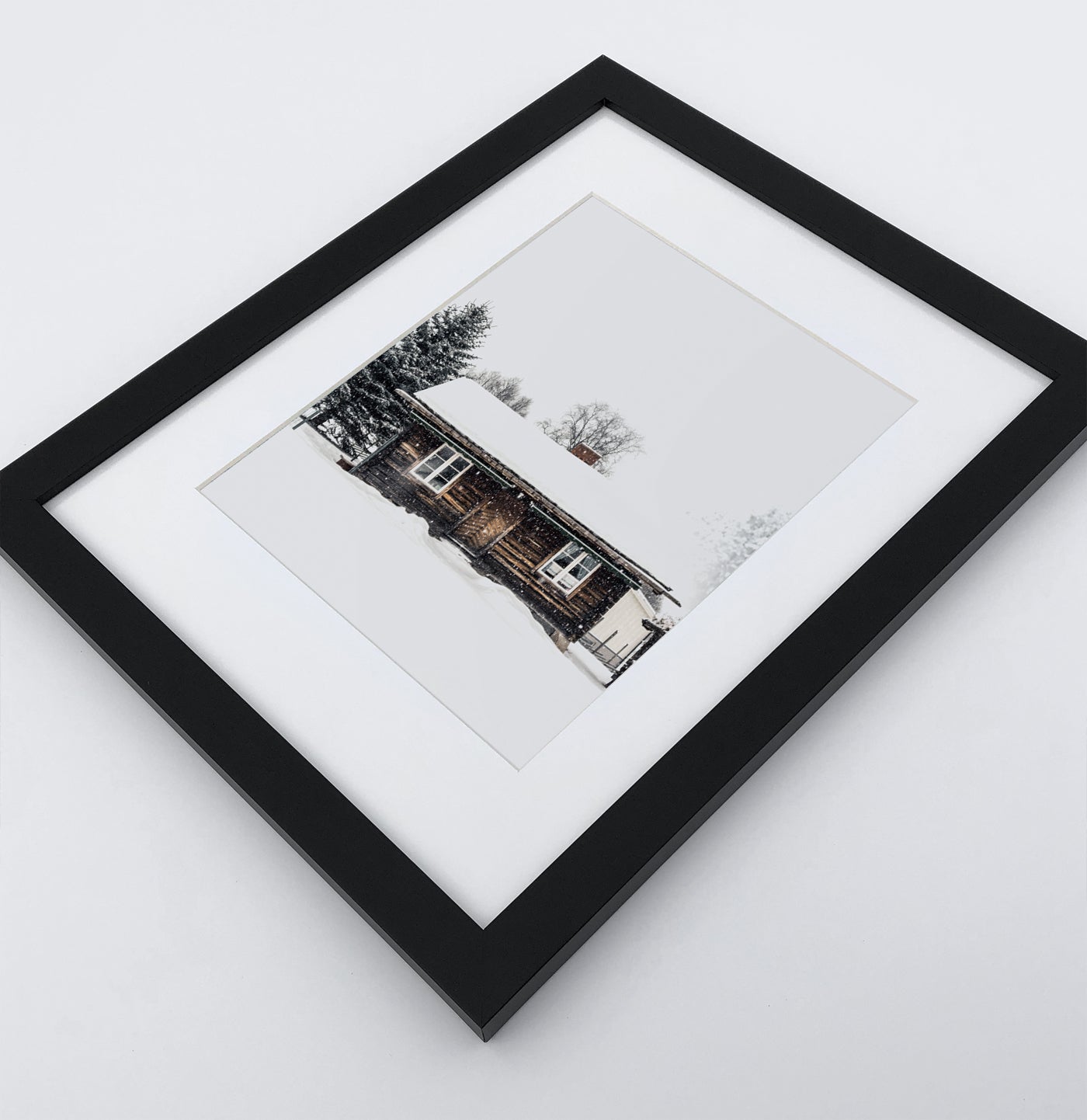 A photo print with a winter house