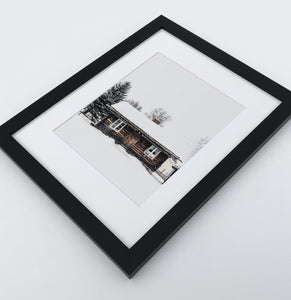 A photo print with a winter house