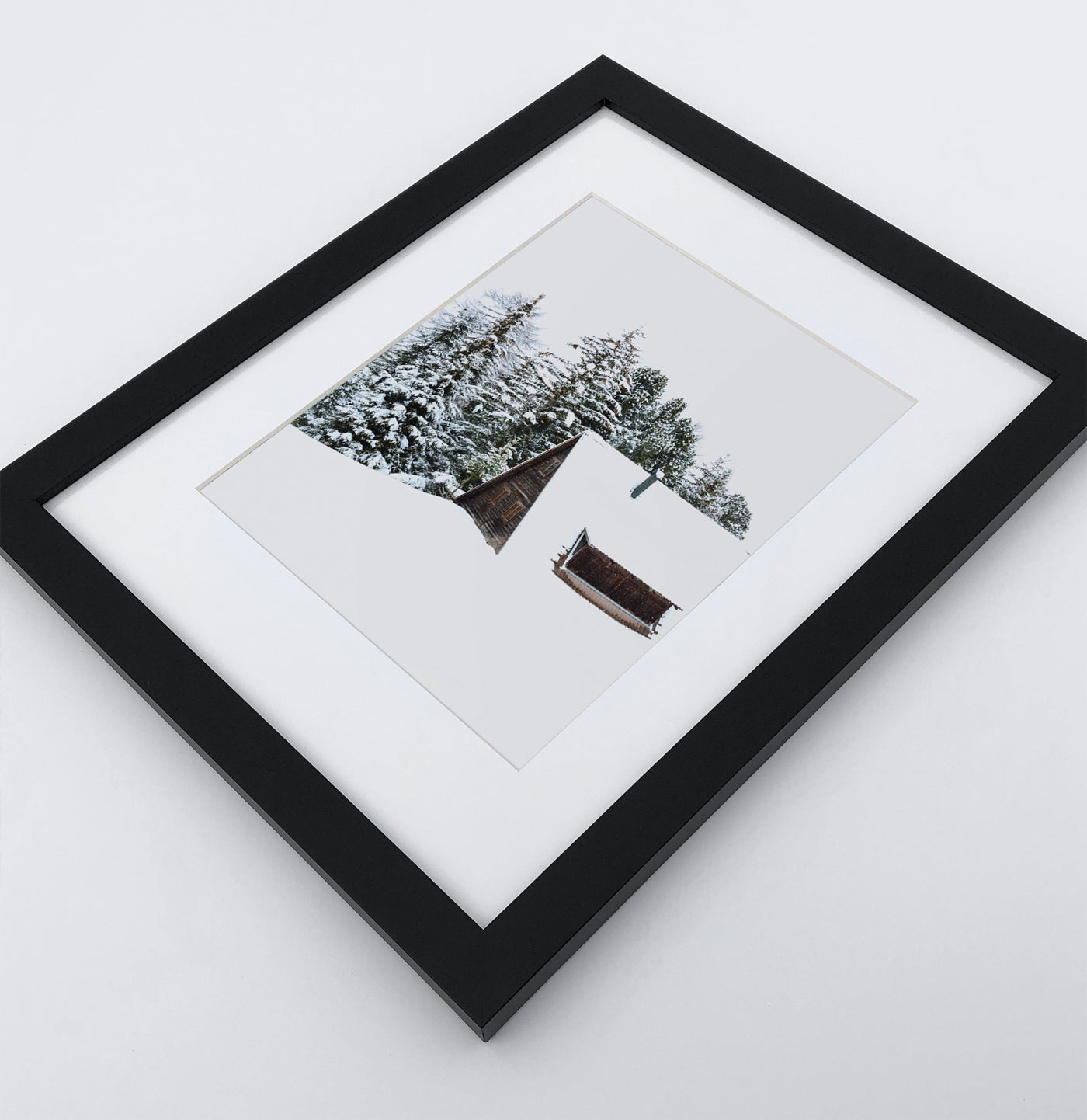 A photo print with a winter house