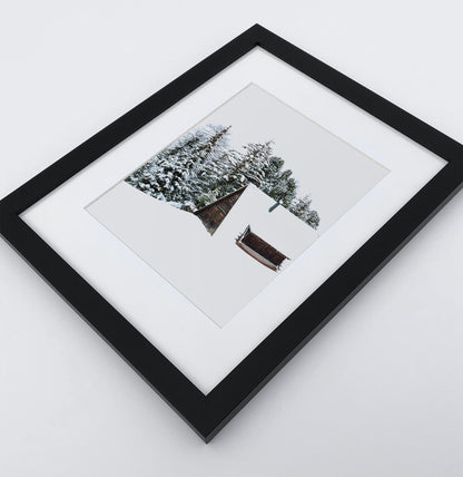 A photo print with a winter house