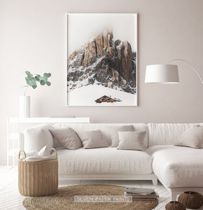 White-framed Snowy House Under A Cliff In The Mountains Wall Art