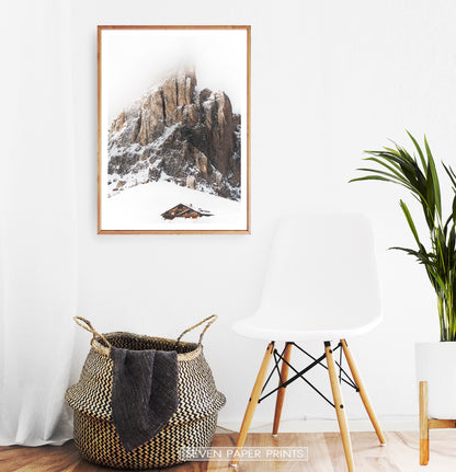 Wooden-framed Snowy House Under A Cliff In The Mountains Wall Art