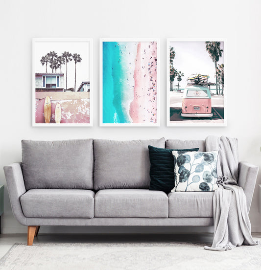 Three superb bright azure and pink photo prints of California beach house, surfing boards, a coast and a surfing miniwan in white frames