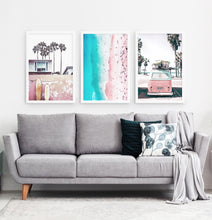 Load image into Gallery viewer, Three superb bright azure and pink photo prints of California beach house, surfing boards, a coast and a surfing miniwan in white frames

