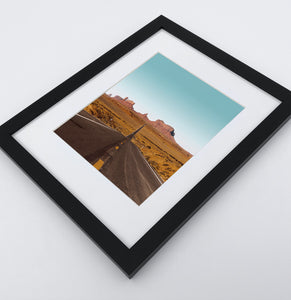 A framed photo print of a Great Canyon highway