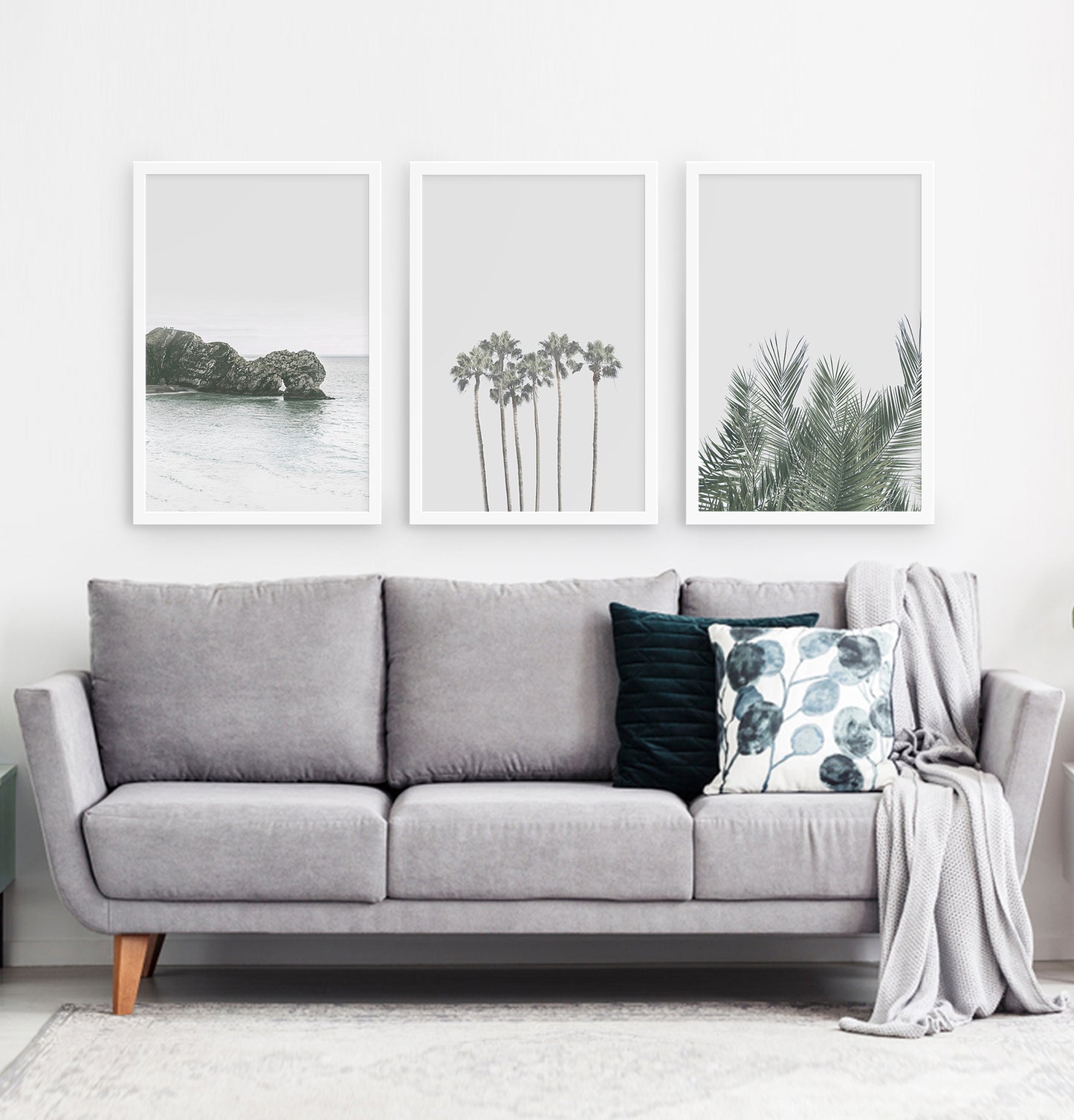 Three framed photo prints with a rock and some palms