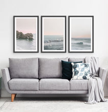 Load image into Gallery viewer, Three ocean photos in frames on a living room wall
