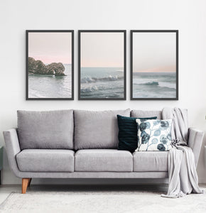 Three ocean photos in frames on a living room wall 2