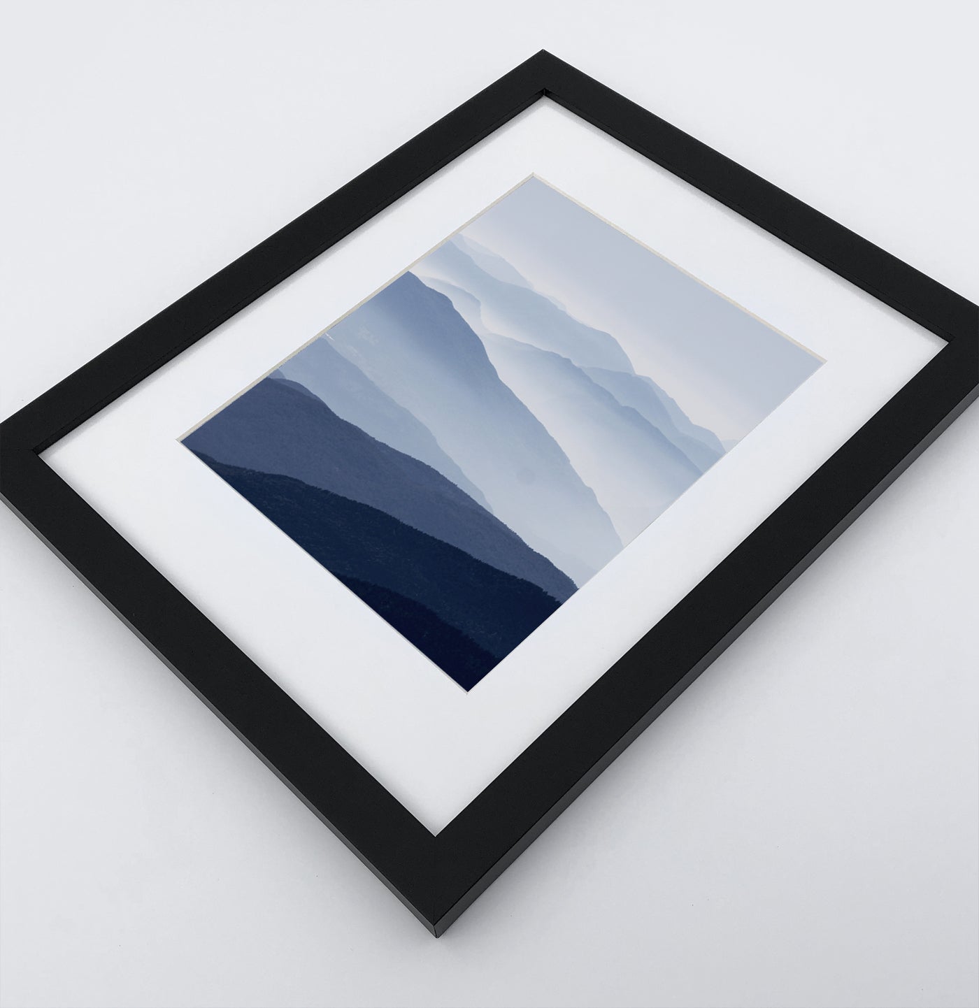 Framed Print of a Foggy Mountain Landscape