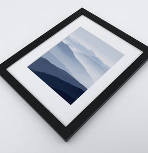 Framed Print of a Foggy Mountain Landscape