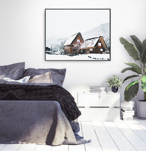 Wall art with wonderful snowy cabins in black frame