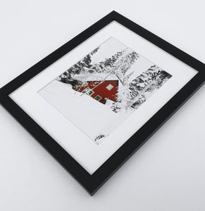 A photo print of a showy forest with a house