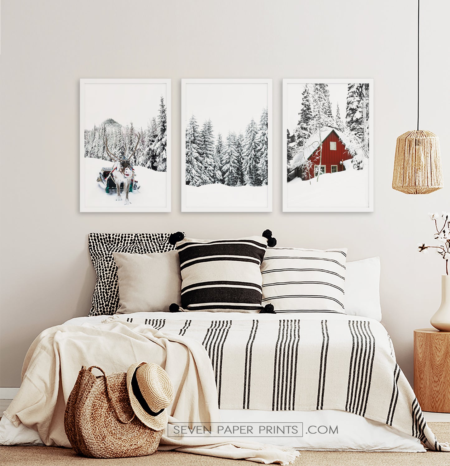 Three photo prints of a showy forest with a deer and a house