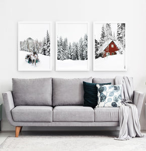 Three photo prints of a showy forest with a deer and a house