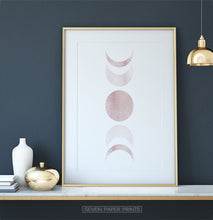 Load image into Gallery viewer, Golden-Framed Moon Phases Watercolor Print in Bage and Brown on a shelf
