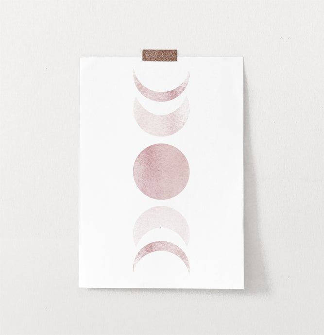 Frameless Moon Phases Watercolor Print in Bage and Brown on a wall
