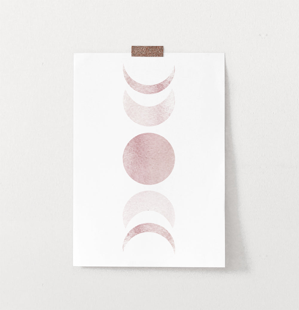 Frameless Moon Phases Watercolor Print in Bage and Brown on a wall
