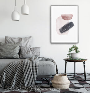 Black-Framed Handpainted Watercolor Print with Beige, Black and Brown on a bedroom wall