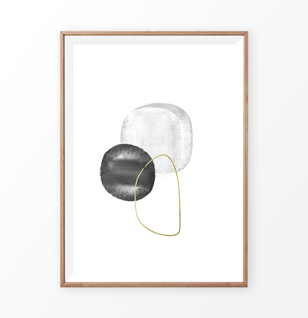 A brown-framed wall art with black, silver and golden forms