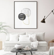 Load image into Gallery viewer, A black-framed wall art with black, silver and golden forms in a living room
